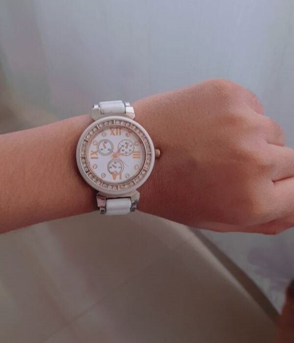 white stainless watch